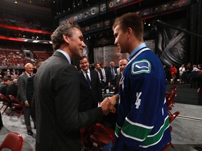 Nikita Tryamkin greets his Canucks president Trevor Linden at 2014 draft in Philly. (Photo by Dave Sandford/NHLI via Getty Images)