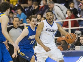 Lethbridge Pronghorns Rob Olsen (left) and Jared Baker try to slow UBC Thunderbirds’ Jordan Jensen-Whyte during Canada West quarterfinal Friday at War Memorial Gymnasium. UBC swept the Pronghorns to earn a place in the conference’s Final Four championships beginning Friday at Calgary. (Bob Frid, UBC athletics)