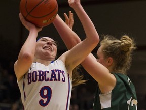 Brookswood's Tavia Jasper (left) battles with Oak Bay's Georgia Alexander on Final 4 Friday at the Langley Events Centre. (Gerry Kahrmann, PNG)