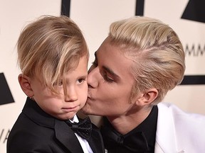 Justin Bieber with is brother Jaxon at the Grammy Awards last month. Good hair, it runs in the family. (AP files)