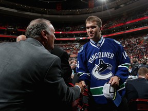 Nikita Tryamkin meets with his team after being drafted by the Vancouver Canucks on Day Two of the 2014 NHL Draft at the Wells Fargo Center on June 28, 2014 in Philadelphia, Pennsylvania.  (Photo by Bruce Bennett/Getty Images)