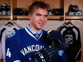 Nikita Tryamkin poses in Philadelphia after becoming the 66th overall pick by the Vancouver Canucks in 2014.