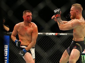 Nate Diaz punches Conor McGregor during UFC 196 at the MGM Grand Garden Arena on March 5, 2016 in Las Vegas, Nevada. (Photo by Rey Del Rio/Getty Images)