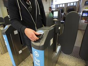 An SFU student taps out with the Compass card at Waterfront station during the testing phase. All gates are due to close on Monday, but a brief glitch Friday showed how quickly things can get chaotic if the gates don't work. (PNG files)