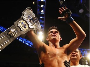 Dominick Cruz celebrates defeating T.J. Dillashaw (not pictured) to win the World Bantamweight Championship during UFC Fight Night 81 at TD Banknorth Garden on January 17, 2016, in Boston, Massachusetts.