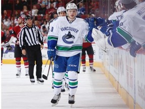 Brendan Gaunce of the Vancouver Canucks celebrates with teammates on the bench after scoring a first-period goal against the Arizona Coyotes at Gila River Arena in October in Glendale, Ariz.