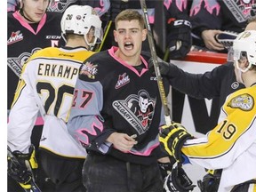 Calgary Hitman Jackson Houck yells at the penalty box after he got the blade of a stick under his visor courtesy of Brandon Wheat Kings Macoy Erkamps in WHL action at the Scotiabank Saddledome in Calgary on Jan. 31. — Postmedia News