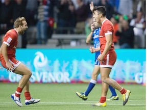 Canada’s Sean White, left, and Nathan Hirayama celebrate after Hirayama kicked a conversion to defeat Australia during World Rugby Sevens Series’ Canada Sevens tournament action on Saturday.