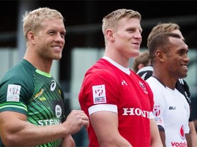 Canadian captain John Moonlight stands with South African counterpart Kyle Brown (left) and Fiji’s Osea Kolinisau on Wednesday as Vancouver gears up for the Canada Sevens rugby tournament.