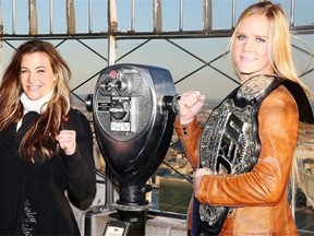 Challenger Miesha Tate, left, and UFC women’s bantamweight champion Holly Holm visit the Empire State Building in New York in January.