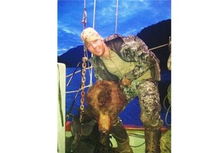 Clayton Stoner displays a grizzly bear head in a photo that prompted debate in 2013.
