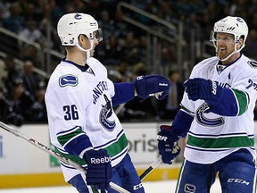 Daniel Sedin (right) and Jannik Hansen celebrate a goal against the San Jose Sharks on March 31. Daniel is the Canucks' MVP in Ben Kuzma's mind, and Hansen is their unsung hero.