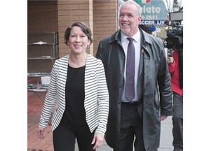 New Democratic Party candidate Melanie Mark tours Commercial Drive with NDP Leader John Horgan on Wednesday while campaigning in the Vancouver-Mount Pleasant byelection.