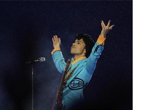 FILE- In this Feb. 4, 2007, file photo, Prince performs during the halftime show at Super Bowl XLI at Dolphin Stadium in Miami.