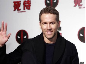 Canadian actor Ryan Reynolds promotes his new film 'Deadpool' before its release in Taiwan last month. He told a U.K. television show he keeps the costume from the Vancouver-shot movie in his TV room, where it scares his dogs.