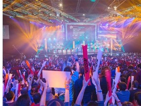 Fans watch the opening ceremony of the League of Legends season 4 World Championship Final between South Korea against China's Royal Club, in Paris on May 11, 2014. Cineplex has launched its first national video game tournament in hopes of capitalizing on the growing popularity of competitive gaming. The theatre chain's foray into gaming tournaments is aimed at a younger demographic being pulled away from movie theatres by mobile phones, YouTube and social media.