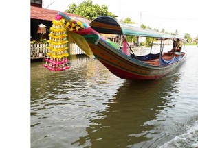 Fantail boats can be hired to explore the many canals that meander throughout Bangkok, Thailand.   Michael McCarthy/Special to The Province