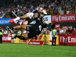 Zack Test smashes New Zealand's Augustine Pulu at the Dubai Sevens in December.