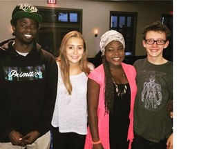 Josiah Wilson, 20, left, is shown with his brother and sisters at a Calgary restaurant in September 2015. Wilson was adopted as a baby from Haiti by a B.C. family.