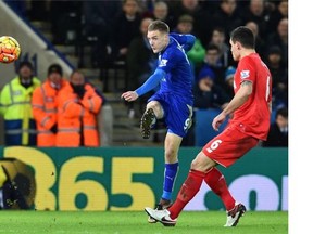 Leicester City striker Jamie Vardy, left, shoots to score the opening goal against visiting Liverpool on Feb. 2.   — Getty Images files