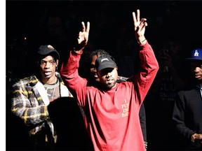 Kanye West gestures to the audience at the unveiling of the Yeezy collection and album release for his latest album, "The Life of Pablo," Thursday, Feb. 11, 2016 at Madison Square Garden in New York.