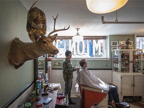 Senior barber Rich Hope (seen here cutting James Darby's hair) at The Belmont Barbershop in Vancouver. Dustin Fishbook opened The Belmont in 2007, just as the popularity of barbering began to surge.