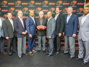 B.C. Lions general manager and head coach Wally Buono introduces his coaching staff to the media in Surrey Tuesday. Left to right are Adam Blasetti, Marcel Bellefeuille, Dan Dorazio, Khari Jones, Buono, Mark Washington, Robin Ross, Chris Tormey and Marcello Simmons.