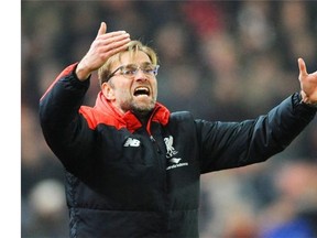 Liverpool manager Juergen Klopp, known for his animated demeanour during matches, gestures during a recent match.