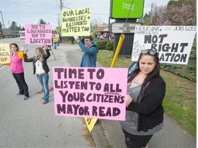 Maple Ridge residents protest outside the city’s Quality Inn, which B.C. Housing plans to convert into homeless housing.