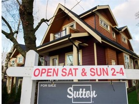 Metro Vancouver home sales set an all-time record in 2015, the region’s real estate board said Tuesday, with the benchmark price for detached properties surging 24.3 per cent year-over-year in December to $1.248 million.   Gerry Kahrmann/PNG files