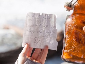 The bottle and message found by Victoria student Caleb Harding while walking on China Beach near Victoria.