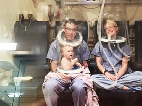 Kyle and Monique Ruppel and their daughter Celia undergo treatment in a hyperbaric chamber at Vancouver General Hospital.