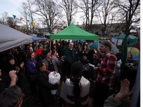Ivan Drury, with the Alliance Against Displacement, speaks to residents at the homeless camp, also known as InTent City, during a block party at the camp in Victoria, B.C., Thursday, February 25, 2016. Supporters came over from Vancouver and Abbotsford during the planned soft eviction day.
