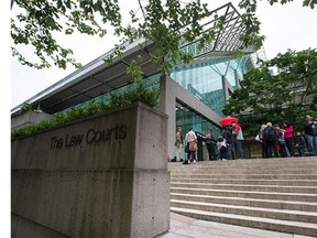 A man accused of voyeurism at the B.C. Institute of Technology was not in court Tuesday as a judge set a March date for his arraignment.