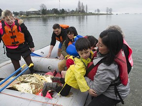 Several dozen people took part in an event at Sunset Beach in Vancouver, BC Saturday, February 27, 2016 to call attention to the plight of refugees fleeing war at home and struggling to reach safety in Europe and elsewhere. The goal of the event's organizers is to raise awareness about the need for safe passage for refugees and migrants seeking asylum.