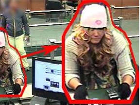 A suspect wearing a dress and long, blond curly wig plus a pink toque has been arrested in an alleged bank robbery in Surrey.