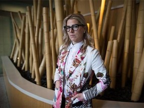 Former WestJet flight attendant Mandalena Lewis stands for a photograph in Vancouver, B.C., on Tuesday March 8, 2016. Lewis, fired after reporting an alleged sexual assault by one of the airline's pilots, says she is shocked at the positive response she's received since sharing her story publicly.THE CANADIAN PRESS/Darryl Dyck
