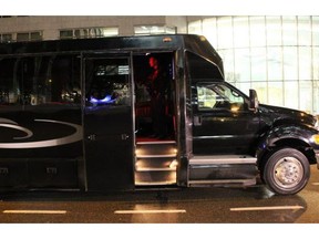 A police officer checks over the interior of a party bus after a woman fell from the open door and was hit and killed on Jan. 10, 2016.