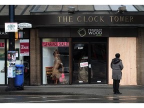The Clock Tower Art Gallery on Granville St and W Broadway is boarded up after a car smashed through the window in Vancouver, BC., January 24, 2016.