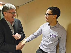 Nathan Pachal (right) was congratulated by fellow candidate Kiernan Hillan after Pachal won the Langley City byelection Feb. 27.