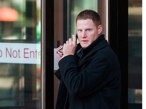 William (Billy) Fisher leaves BC Provincial Court in Vancouver, BC, September, 10, 2015. Fisher, 30, was convicted and recently sentenced to prison for a number of offences relating to the Stanley Cup riot. He has now died in a New Wesminster hospital.