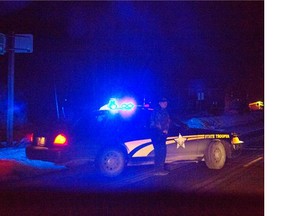 An Oregon state trooper blocks a highway  near where an armed group has been occupying a national wildlife refuge, on Tuesday, Jan. 26.