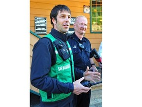North Shore Search and Rescue’s Mike Danks, left, and Vancouver police Const. Jeff Palmer in West Vancouver on Aug. 19, 2014. Danks said seven poorly prepared hikers went onto a trail Sunday night in North Vancouver that was closed due to winter conditions.  Wayne Leidenfrost/PNG files