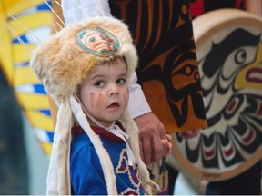 Owen Duncan, 3, of the Da’naxda’xw and Campbell River First Nations, attends Monday’s announcement of an agreement to protect 85 per cent of the Great Bear Rainforest from industrial logging.    — The Canadian Press