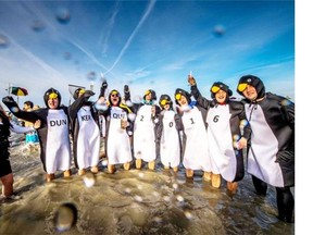 Participants in the traditional New Year's sea plunge on January 1, 2016 at Malo-Les-Bains beach in Dunkirk, northern France.  Port Moody has cancelled its 2016 Penguin Plunge because of leaking boat fuel concerns