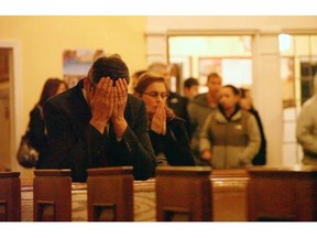 People praying at a church in a scene from the documentary film, Newton, directed by Kim Snyder. MotoFilms/Sundance Institute/The Associated Press