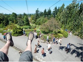 CP photographer Jonathan Hayward flies along the zip line at Queen Elizabeth Park last summer. The attraction is due to return in 2016.