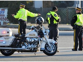 Police direct traffic at a roadblock during a standoff outside the Starlight Casino on Nov. 8, 2012.    Wayne Leidenfrost/PNG files