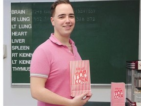 Popcorn in hand, James Highet prepares for movie night in the old Vancouver city morgue, now part of the Vancouver Police Museum.