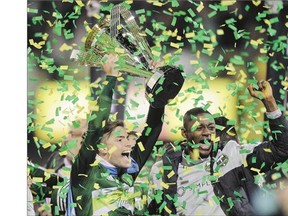 Portland Timbers' Lucas Melano, left, and Fanendo Adi celebrate a 2-1 MLS Cup victory Sunday in Columbus, Ohio.